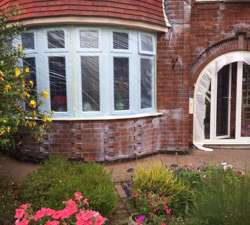 A home being treated with Properla Masonry Creme Coating by home improvement experts Home Fixology.