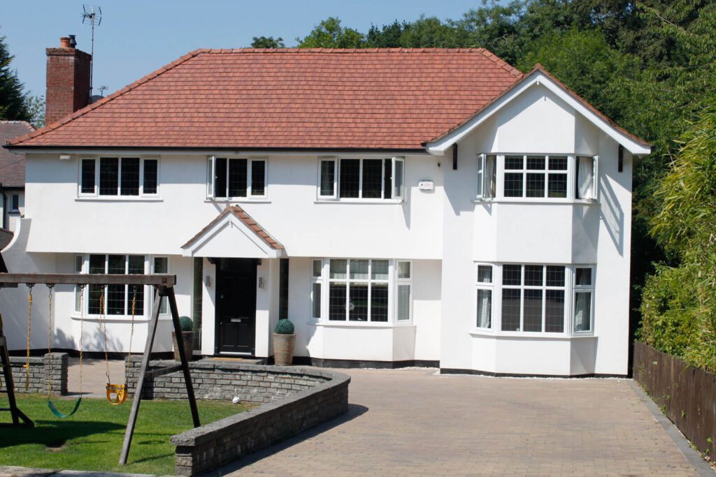A property looking it's best after rendering by home improvement experts Home Fixology.