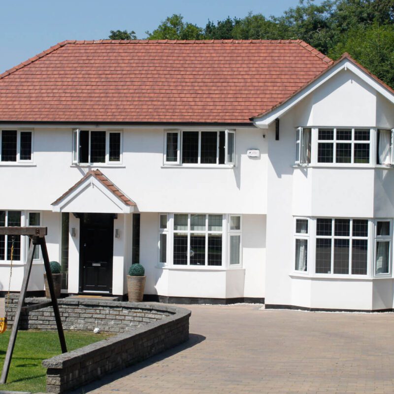 A property looking it's best after rendering by home improvement experts Home Fixology.
