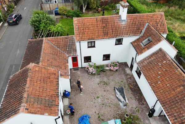 A bird's eye view of a cottage benefiting from having external wall insulation fitted by Home Fixology.