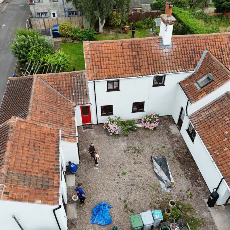 A bird's eye view of a cottage benefiting from having external wall insulation fitted by Home Fixology.