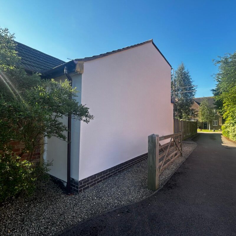 An exterior wall in the shade after Properla Facade Coating which will discourage moss, algae and lichen growth.